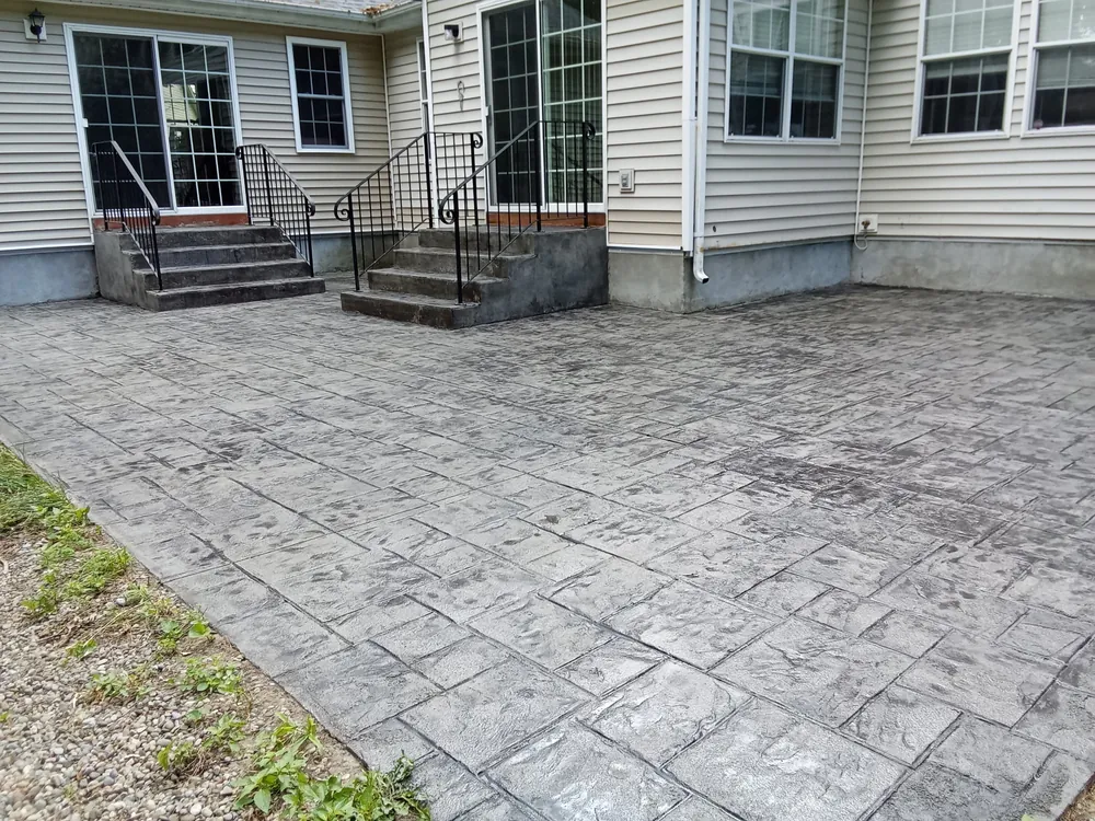 Ashlar slate stamped concrete patio by Edges Unlimited in Saratoga Springs, NY