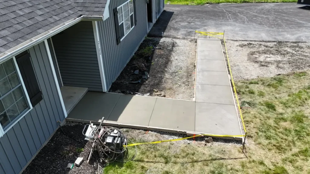 Aerial view of a freshly poured concrete walkway by Edges Unlimited in Clifton Park, NY