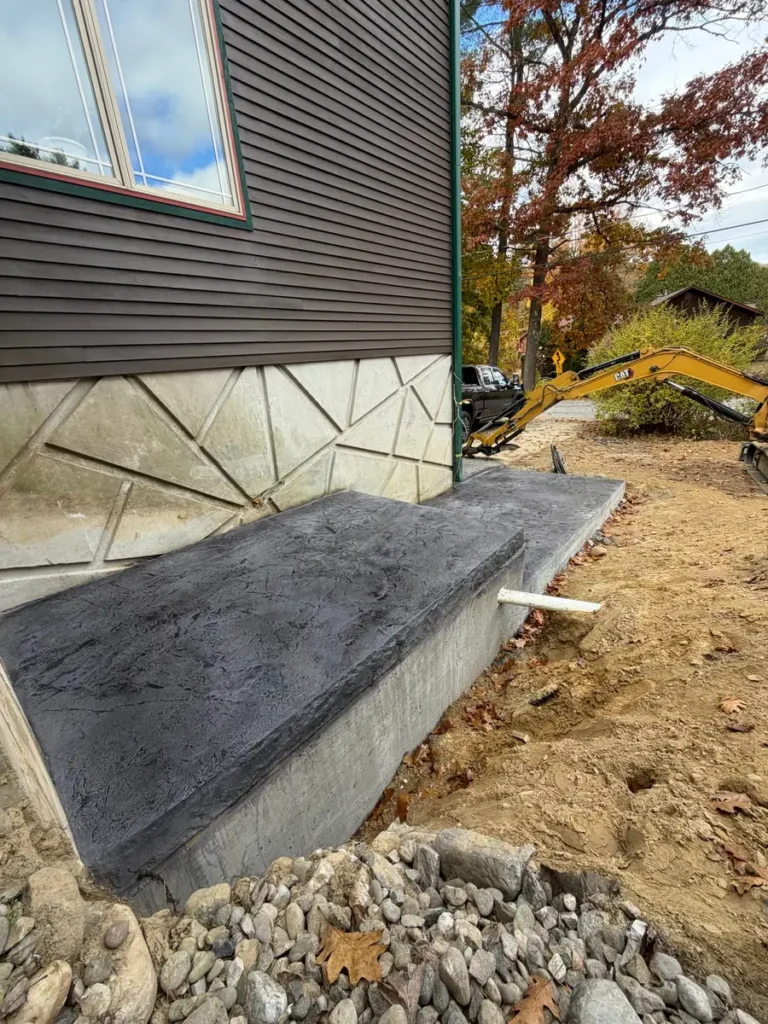 Resealed charcoal stamped concrete landing by Edges Unlimited in Clifton Park, NY