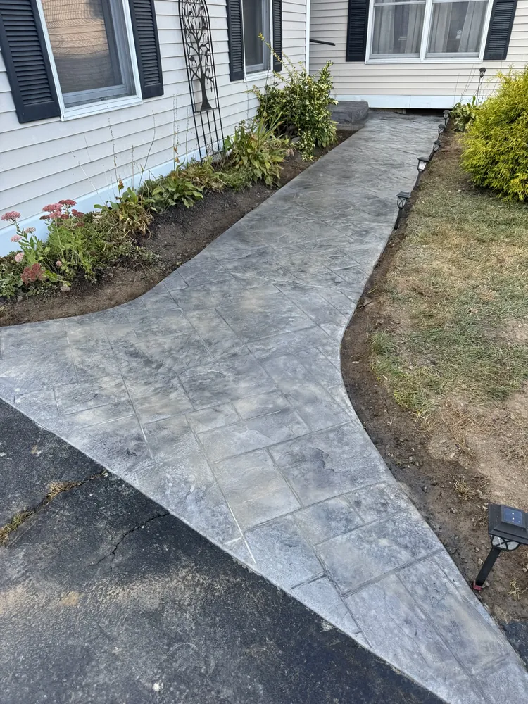 Slate pattern stamped concrete front walkway by Edges Unlimited in Saratoga Springs, NY