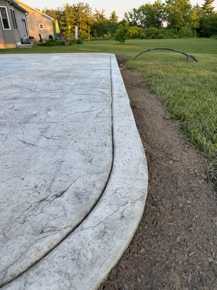 Stamped concrete patio edge detail by Edges Unlimited in Albany, NY