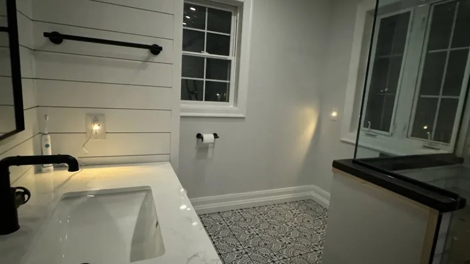 Quartz vanity top against a shiplap wall by Edges Unlimited in Clifton Park, NY