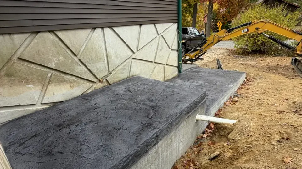 Resealed charcoal stamped concrete landing by Edges Unlimited in Clifton Park, NY